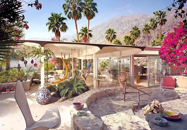 Palm Springs mid-century modern home with pool, swings, and mountain backdrop.