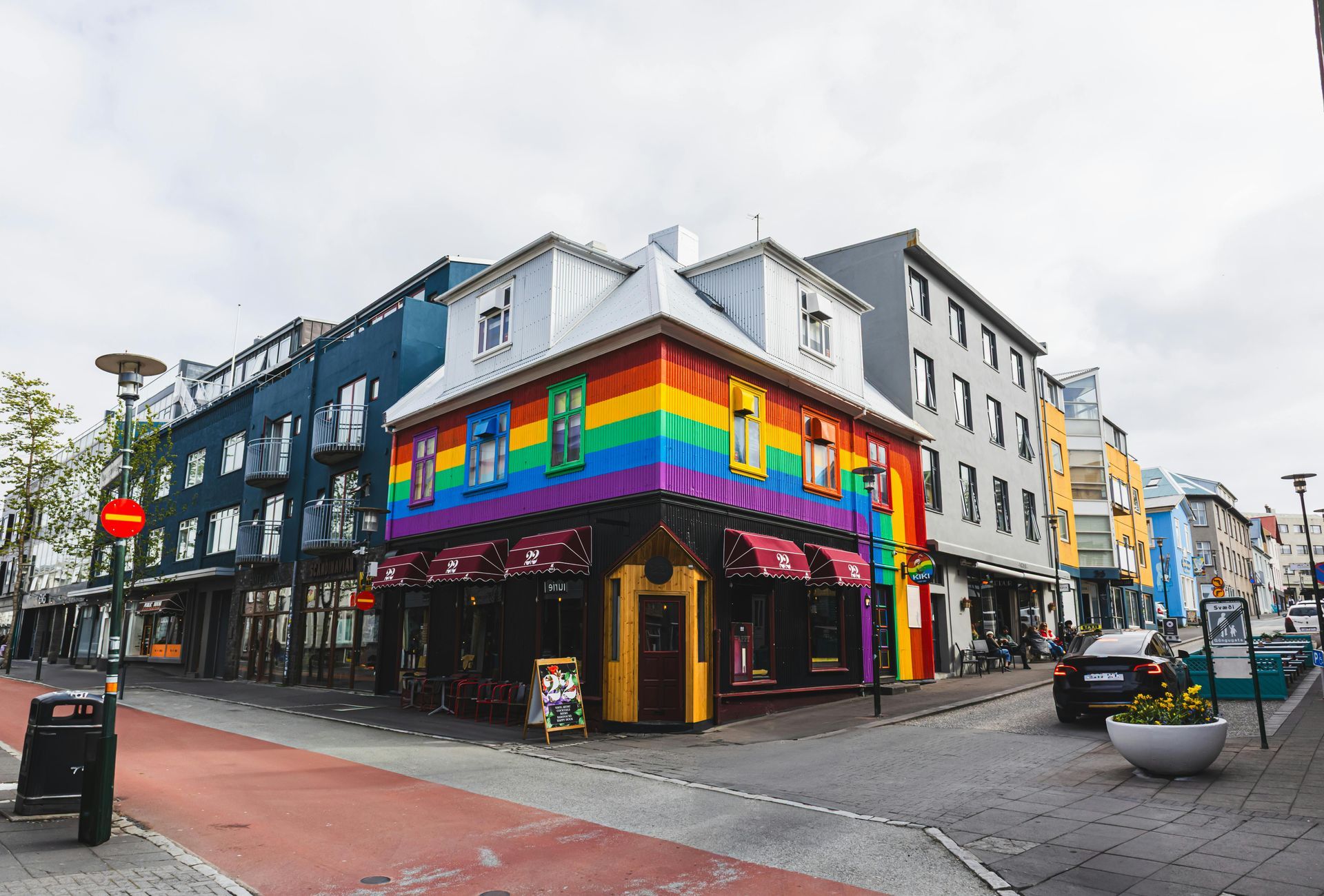 Colorful corner building painted in rainbow colors in Reykjavik, Iceland.