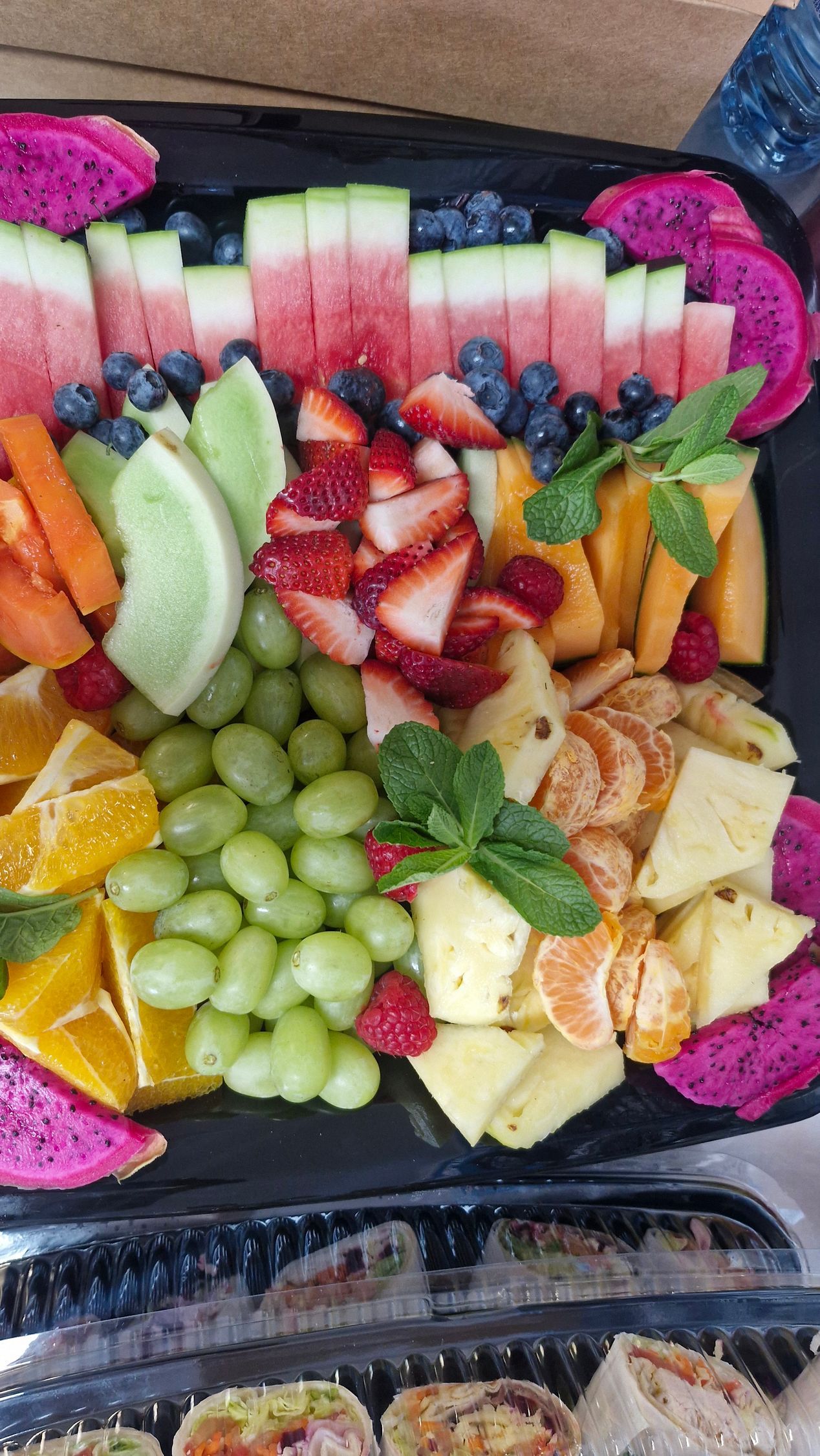 Fruit platter with watermelon, blueberries, strawberries, dragon fruit, and cantaloupe. — Boundary Street Fish & Burger Bar in Railway Estate, QLD