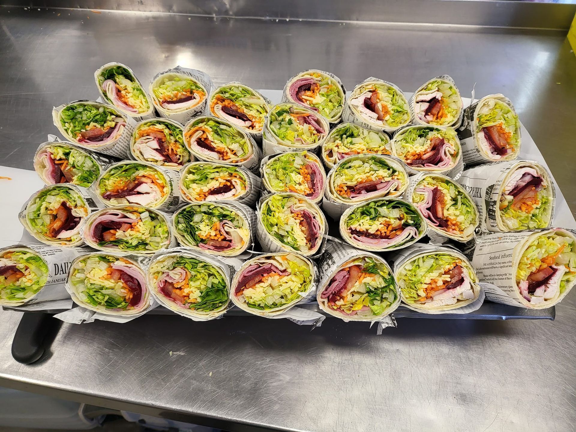 Tray of Cut Wraps, Showcasing Colourful Fillings — Boundary Street Fish & Burger Bar in Railway Estate, QLD