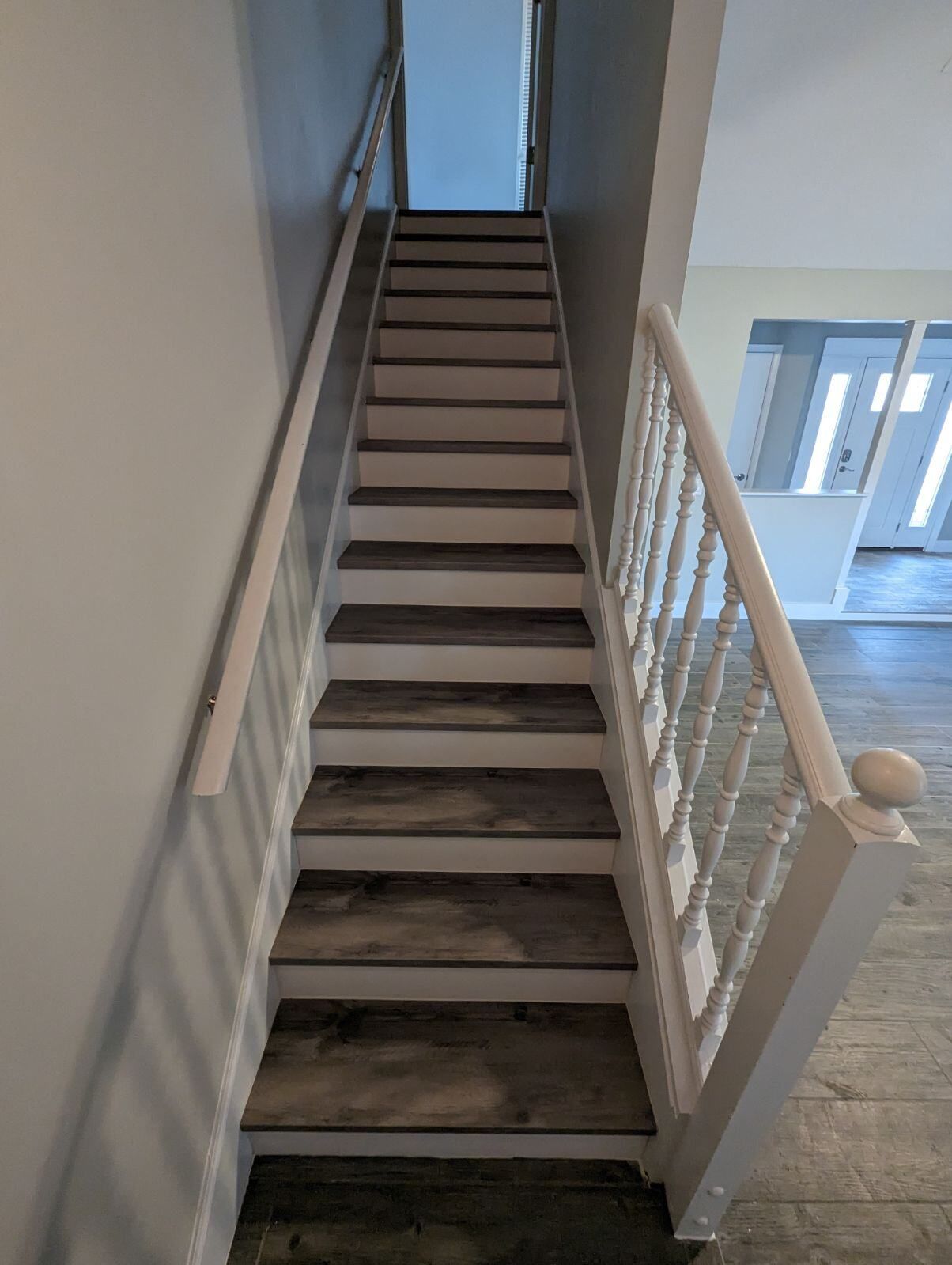 A set of stairs leading up to the second floor of a house.