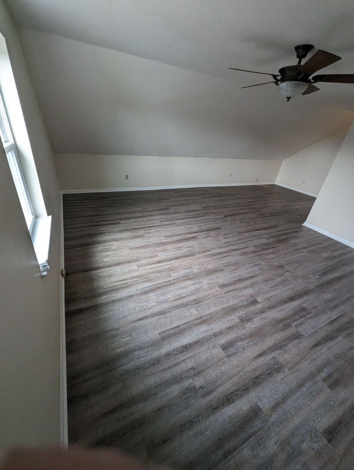 There is a ceiling fan in the room.