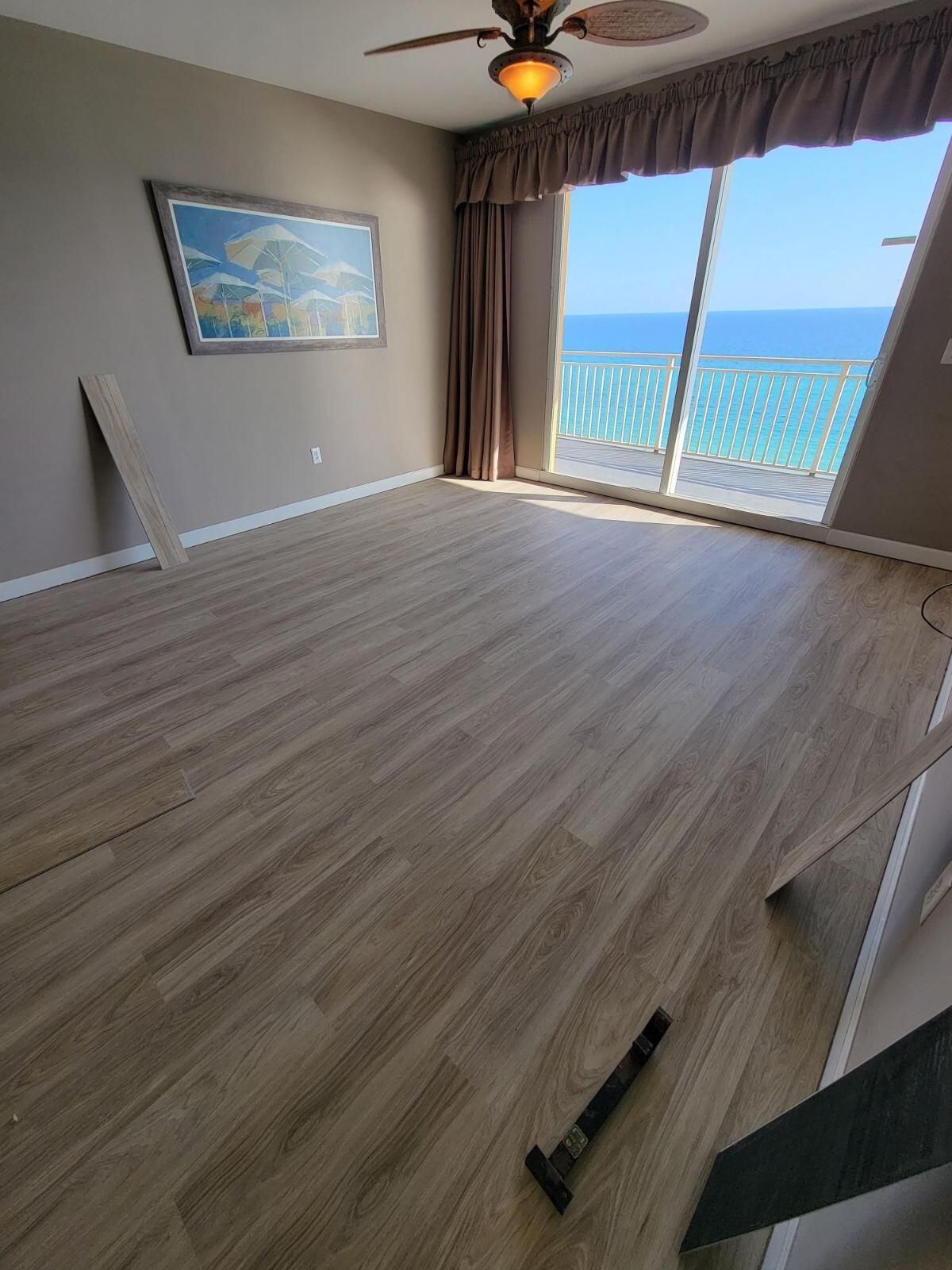 There is a vacuum cleaner on the floor in the middle of the room.