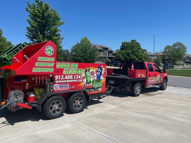 A red truck with a trailer attached to it that says bush city electric