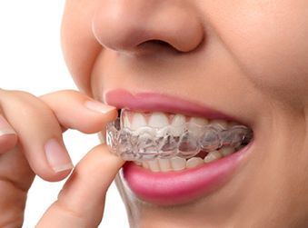 Woman Wearing Orthodontic Silicone Trainer - Orthodontics Dentists in Terre Haute, IN