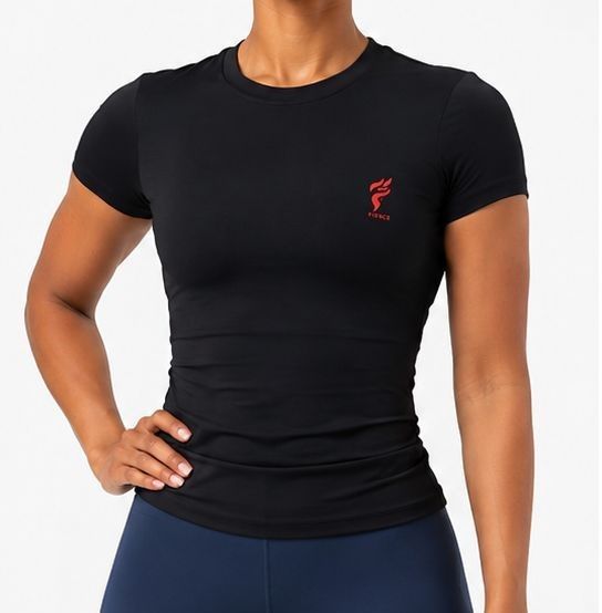 Person in black fitted T-shirt and navy leggings, standing with hand on hip