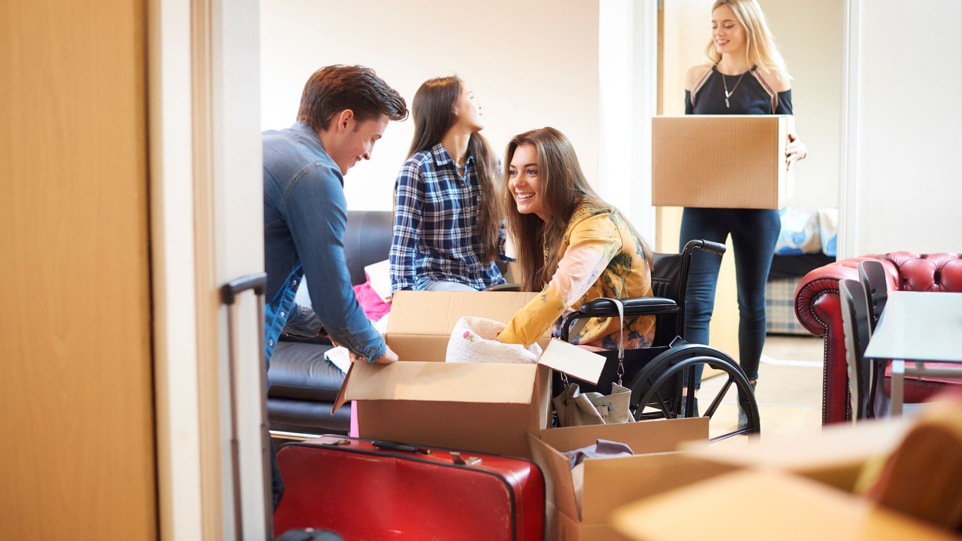 A group of people are moving into a new house.