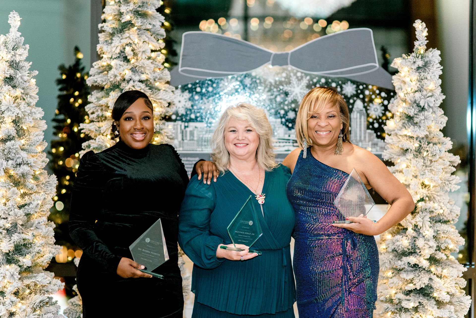 Team members enjoying the Venture Communities holiday party