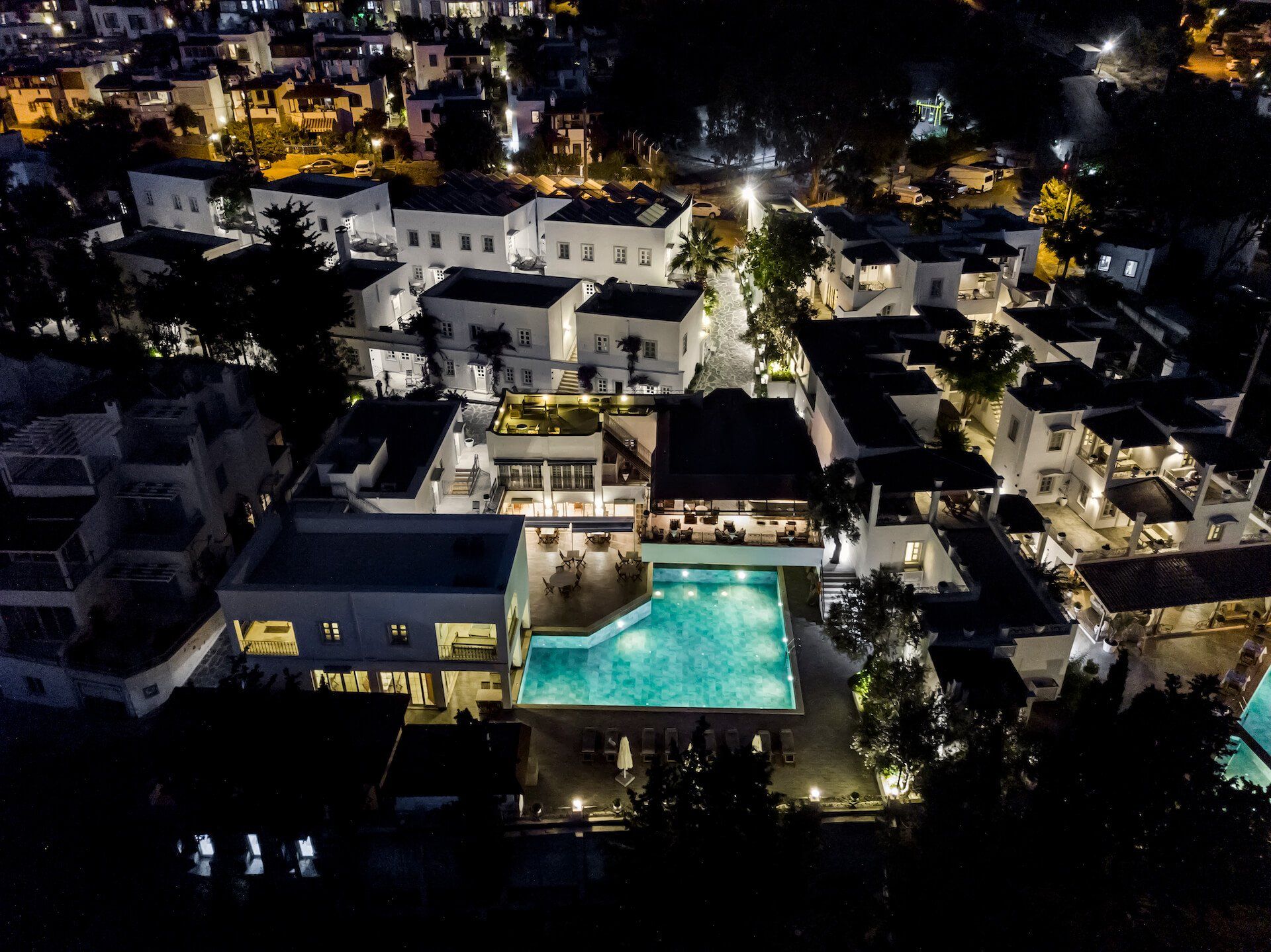 An aerial view of a large swimming pool at night