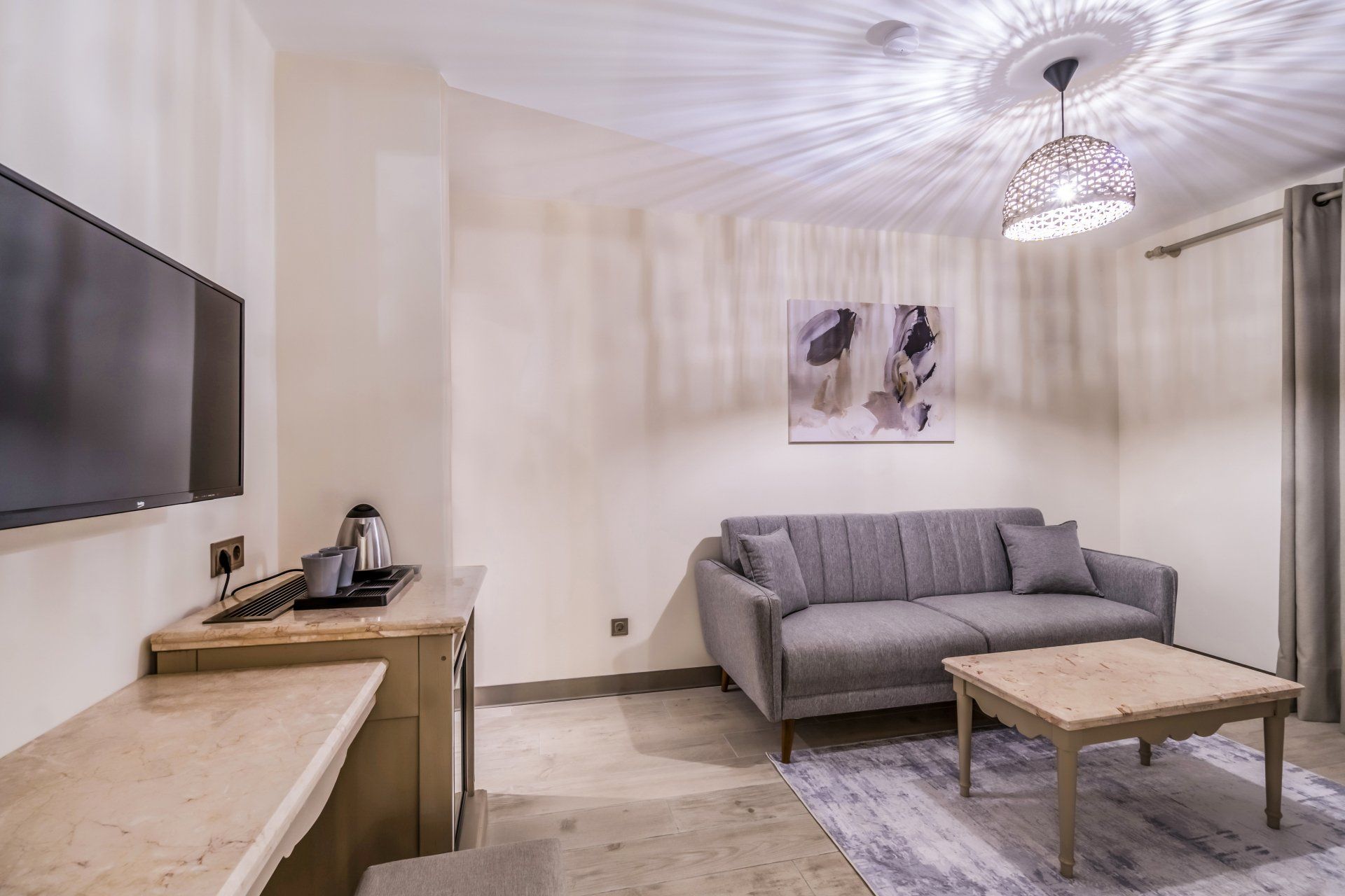 A living room with a couch , table , and television.