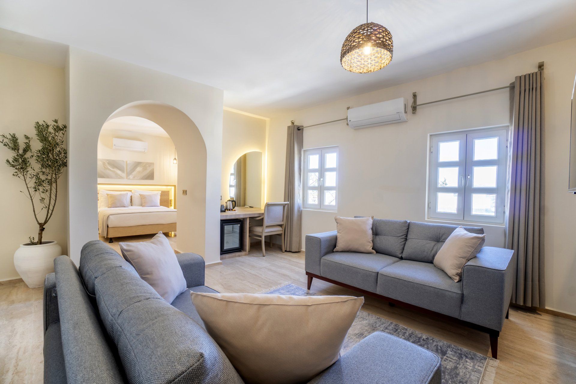 A living room with a couch and a chair in it