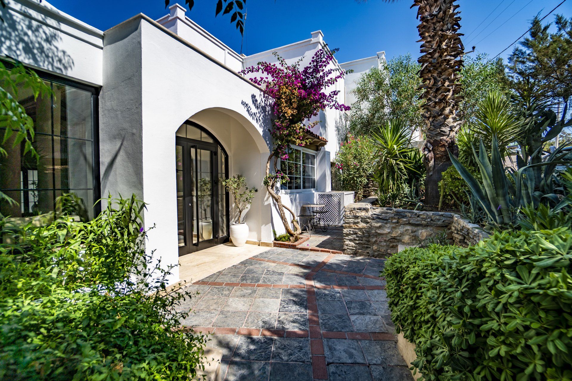 A white house with a walkway leading to it