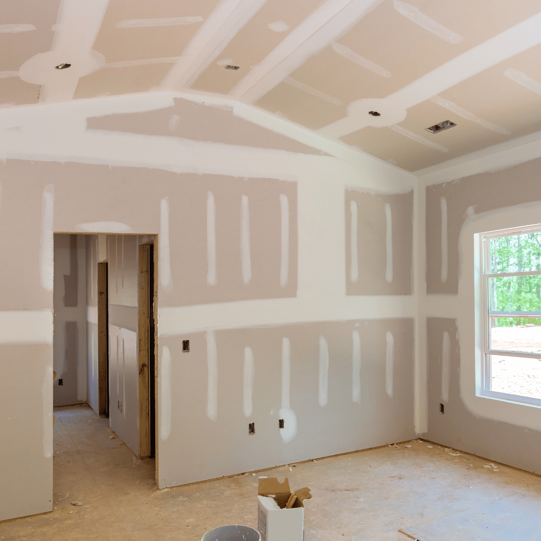 A room that is being remodeled with drywall on the walls