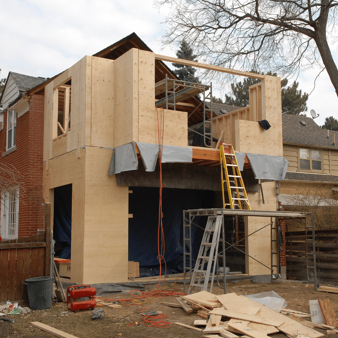 A house that is being built with a ladder in front of it