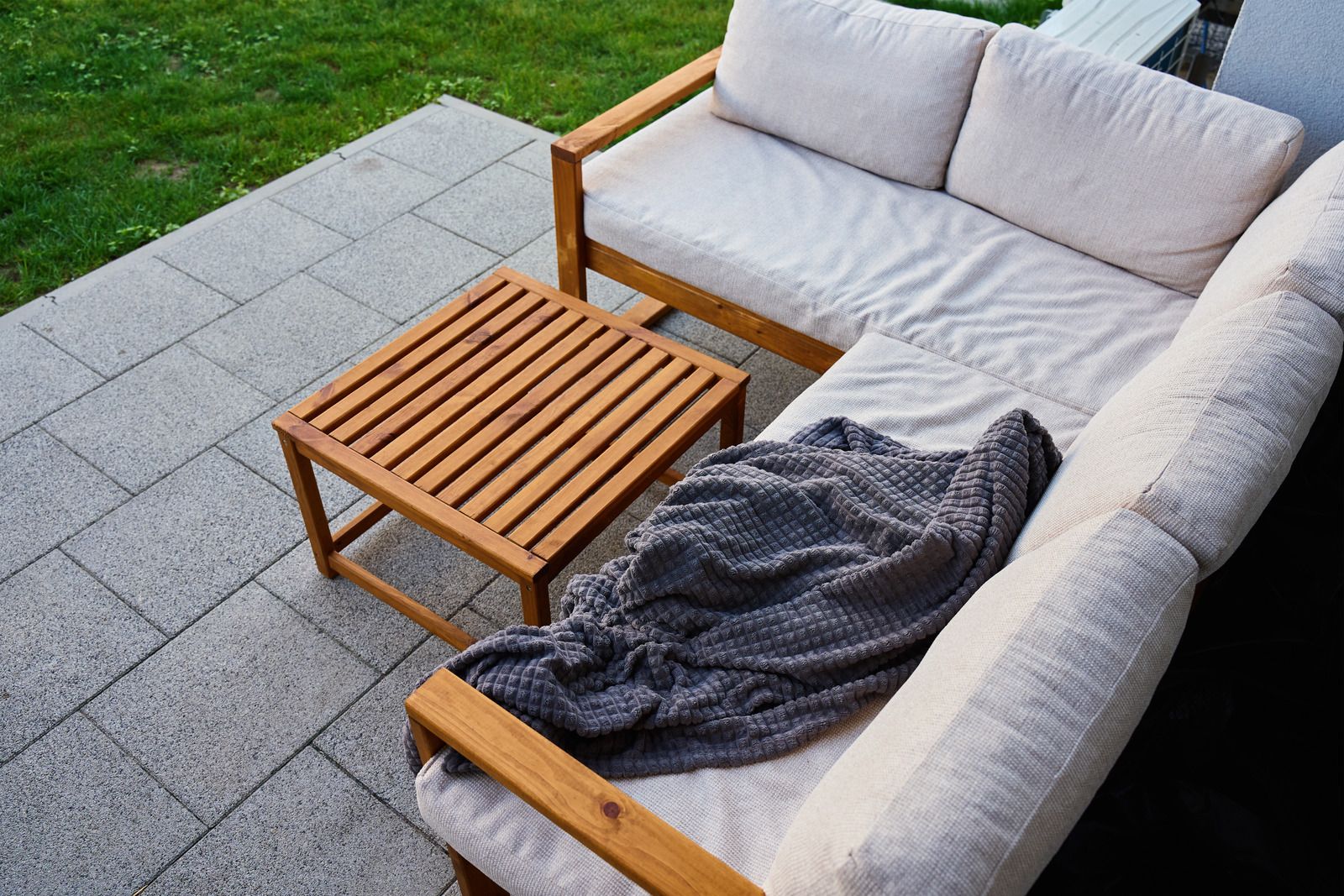 A man wearing a hard hat and goggles is standing in a room.