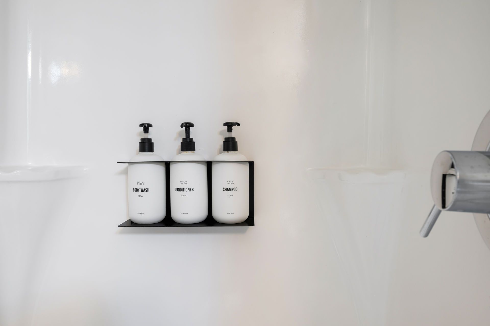 Three white pump bottles labeled