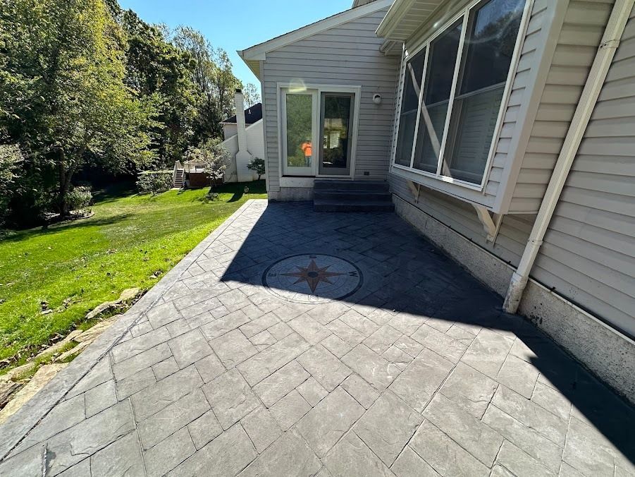 A foundation for a house is being built on a dirt field.