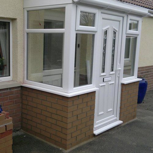 new windows and doors on a porch