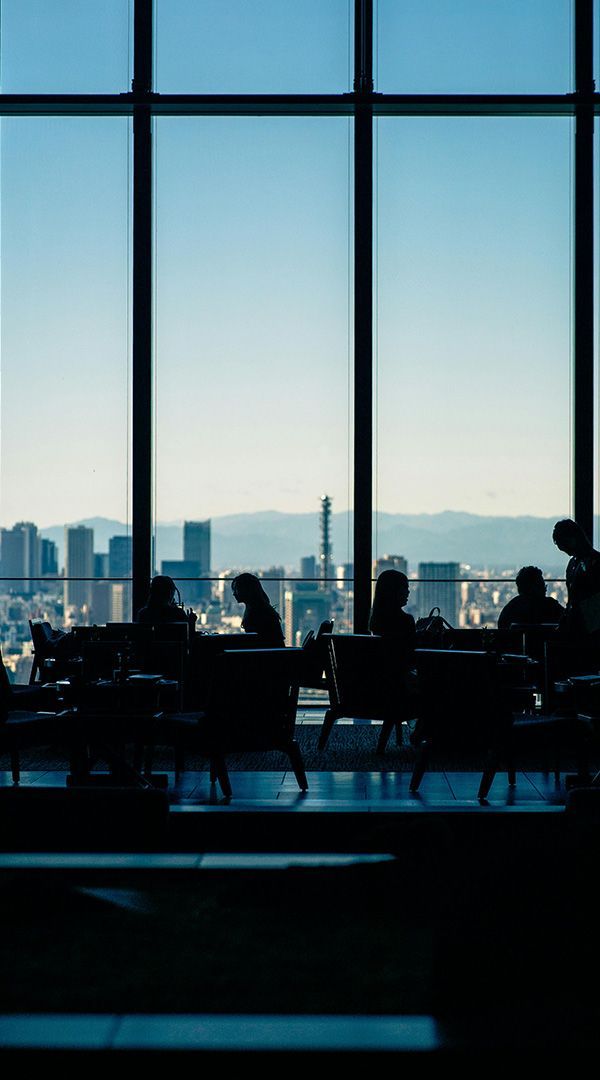 Plastic miniatures sitting at desks and working