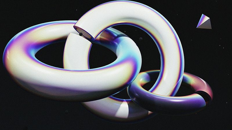 Three interlocked rings, silver, on a back background.