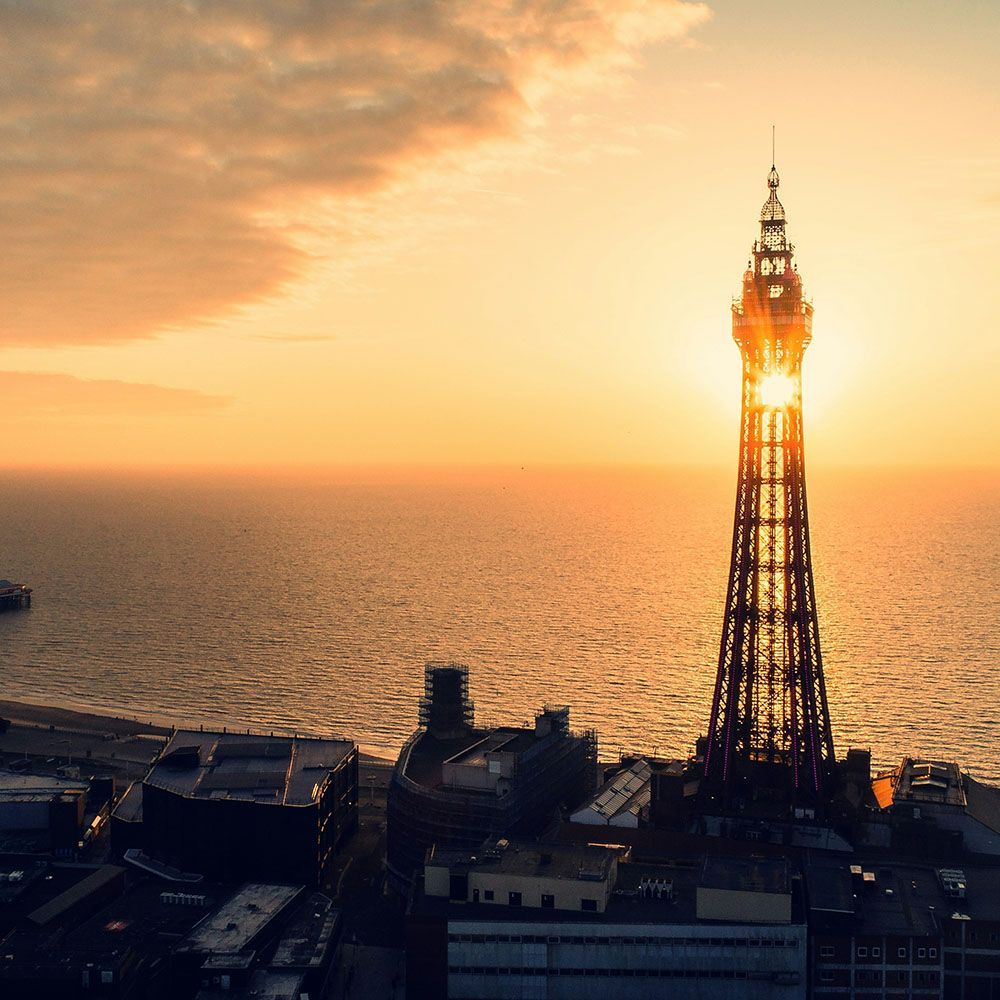 A view out to sea over Blackpool at sunset.