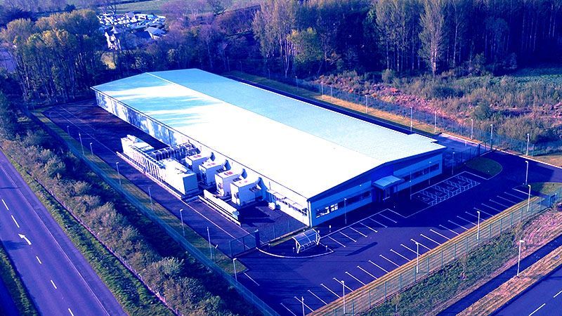 Aerial view of a data centre warehouse in the English countryside