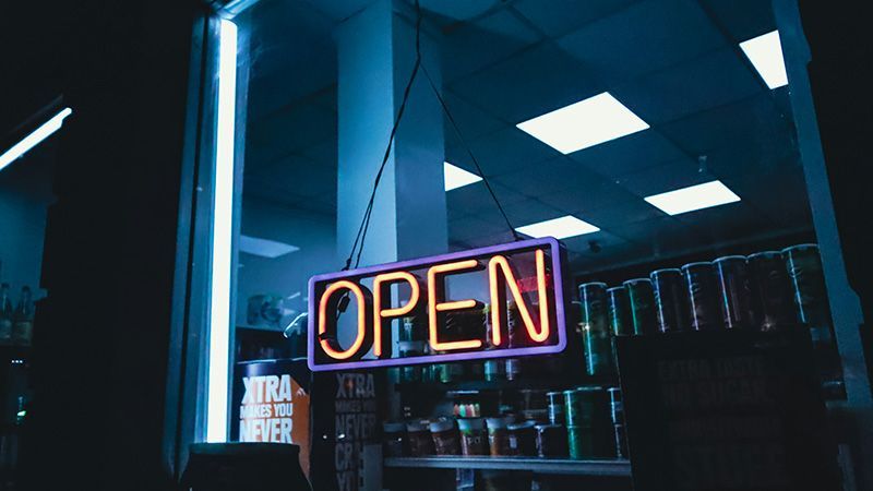 Neon 'Open' sign in business window