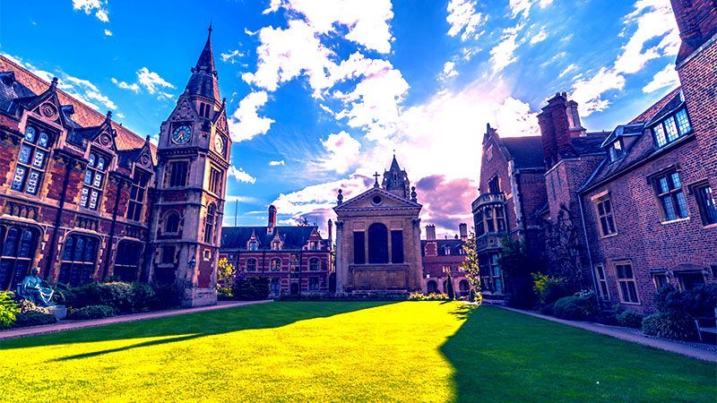 Wide angle photo of Pemrboke College on a sunny day