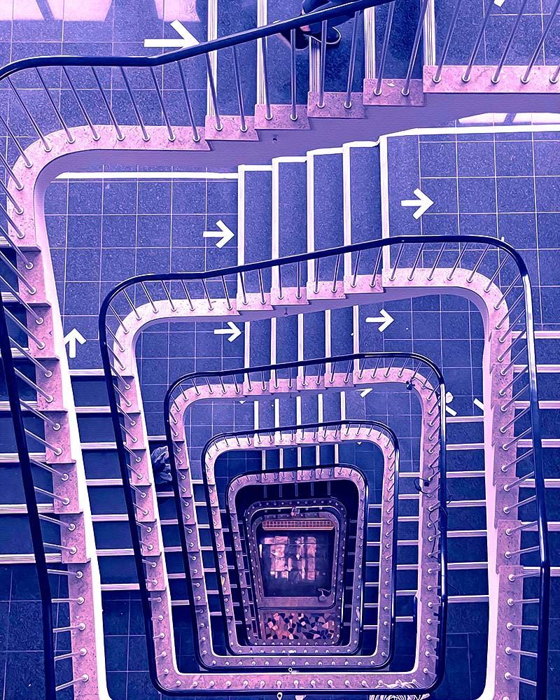 A spiral staircase viewed from above.