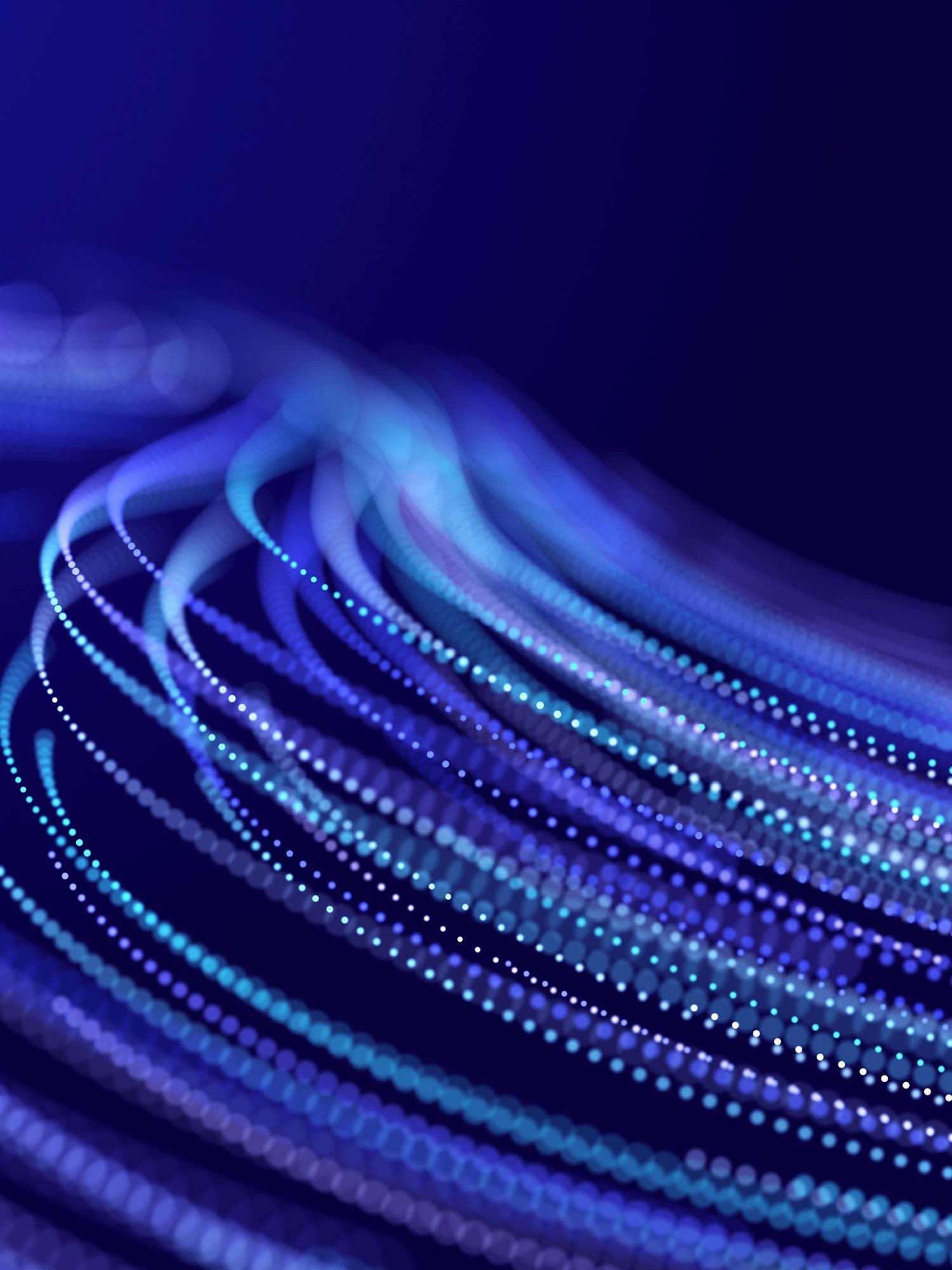 Abstract image of neon strands in a wave that represents optical fibre