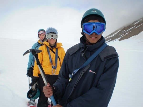 A polar expedition: photo shows three young people in goggles and jackets, one holds an ice pick
