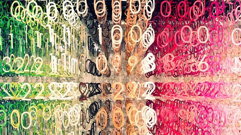 Binary code art installations - hundreds of numbers hanging from the ceiling