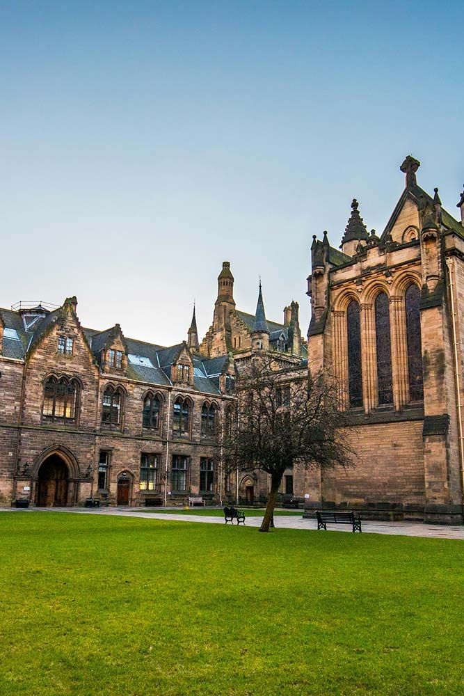 Lawn leading up to one of the Cambridge university campus buildings