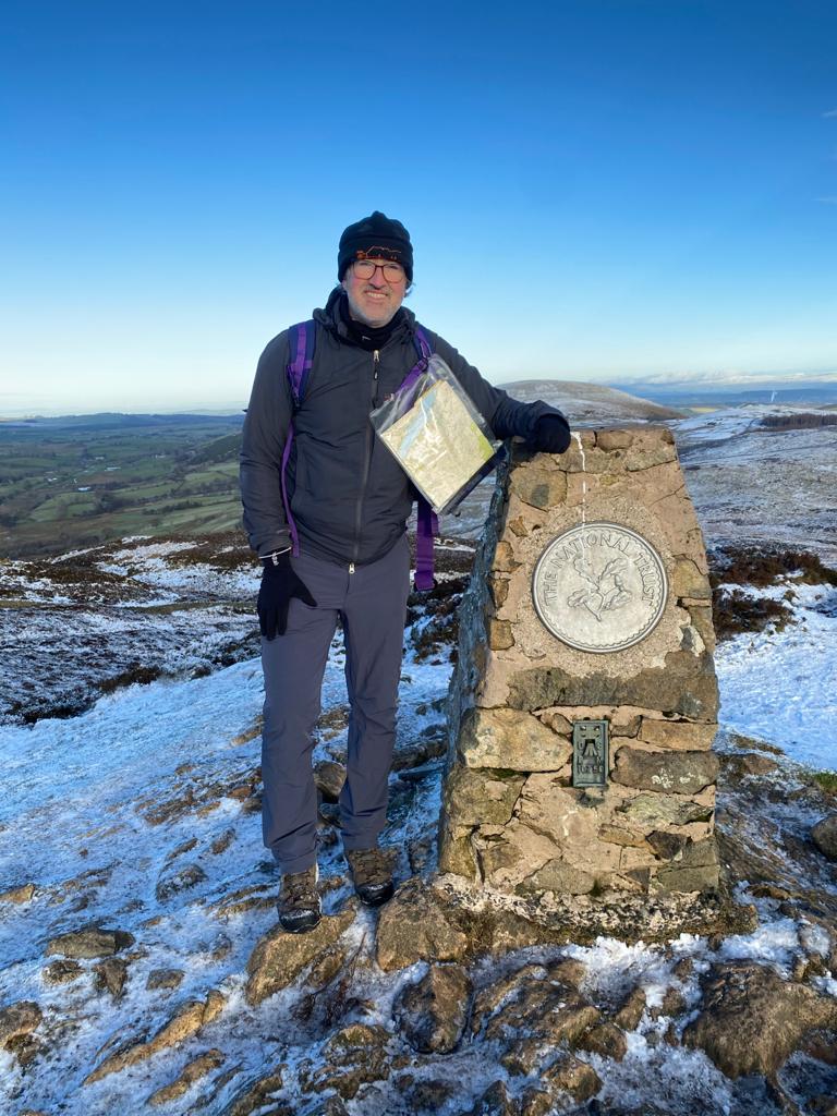 Tim Passingham at the top of Scarfell Pike in the Lake District