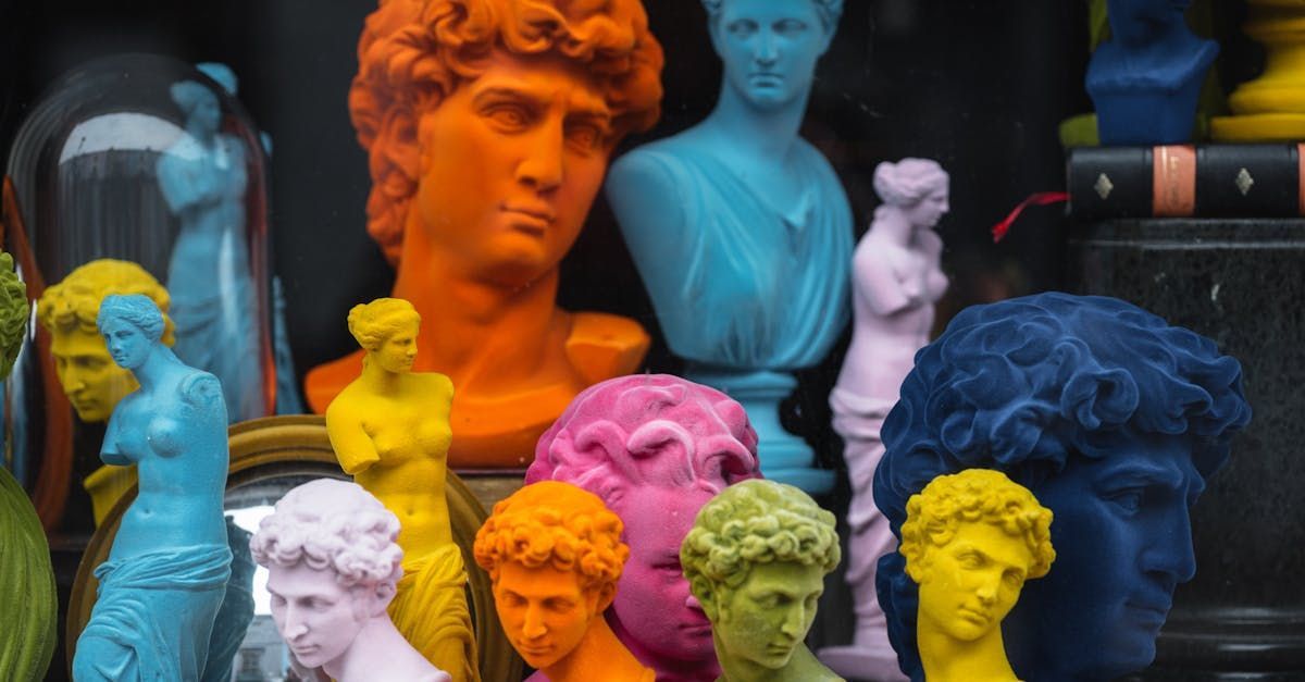 Group of statue heads and busts in bright colours