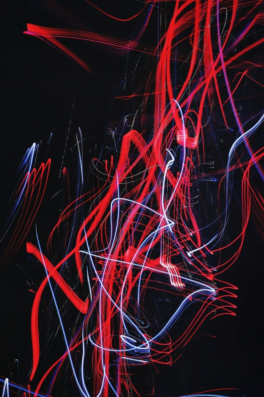 Abstract red and white lines like light writing