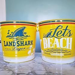 Two yellow Landshark Lager beer buckets. One reads 