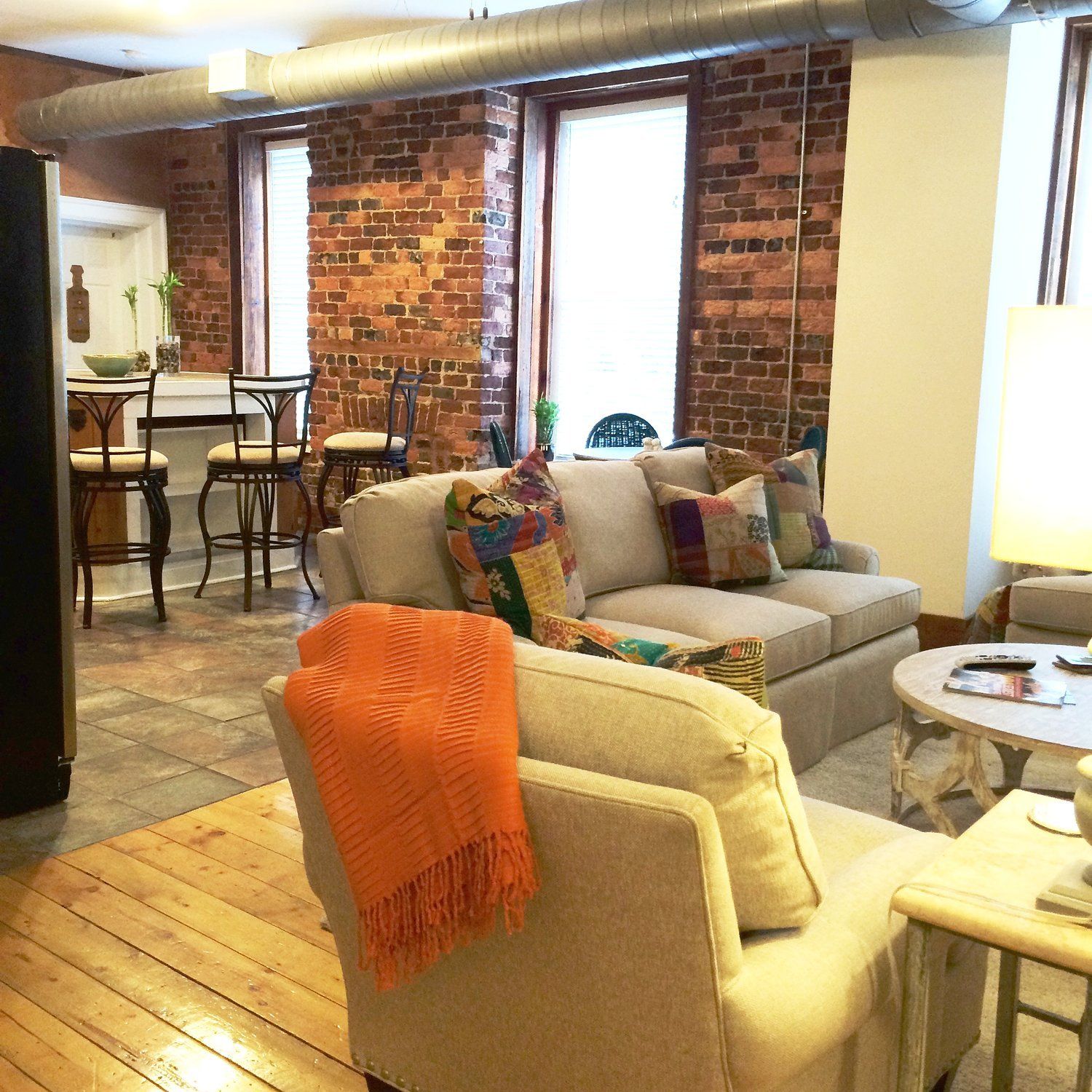 Interior of living room and kitchen view in background
