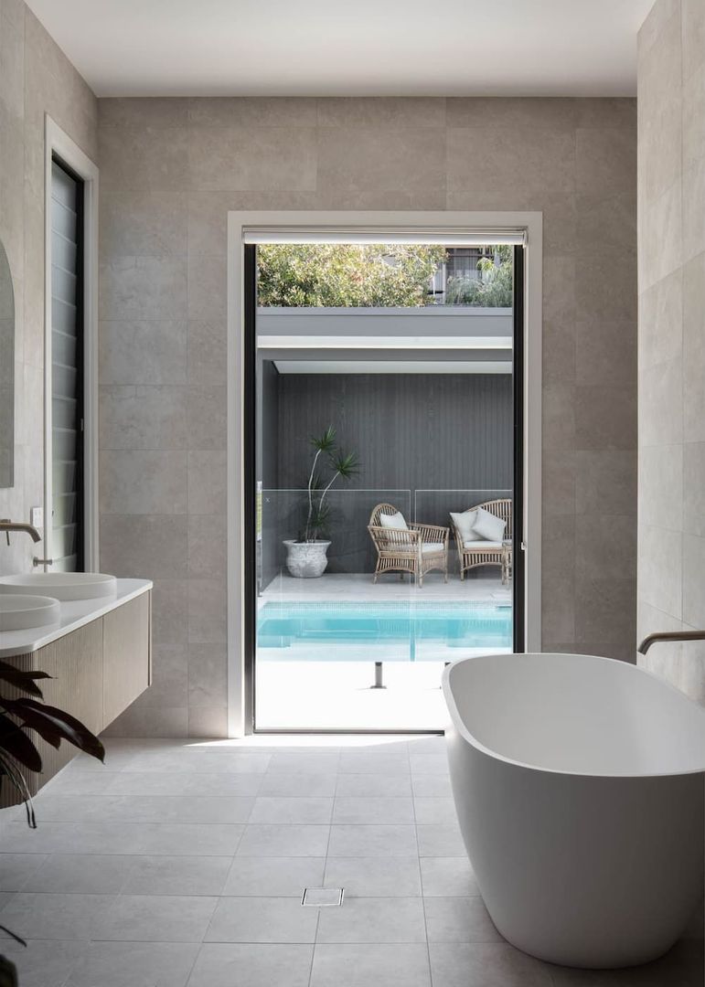 View of the pool from the bathroom — Caroline Jolly Interiors in Bulli, NSW