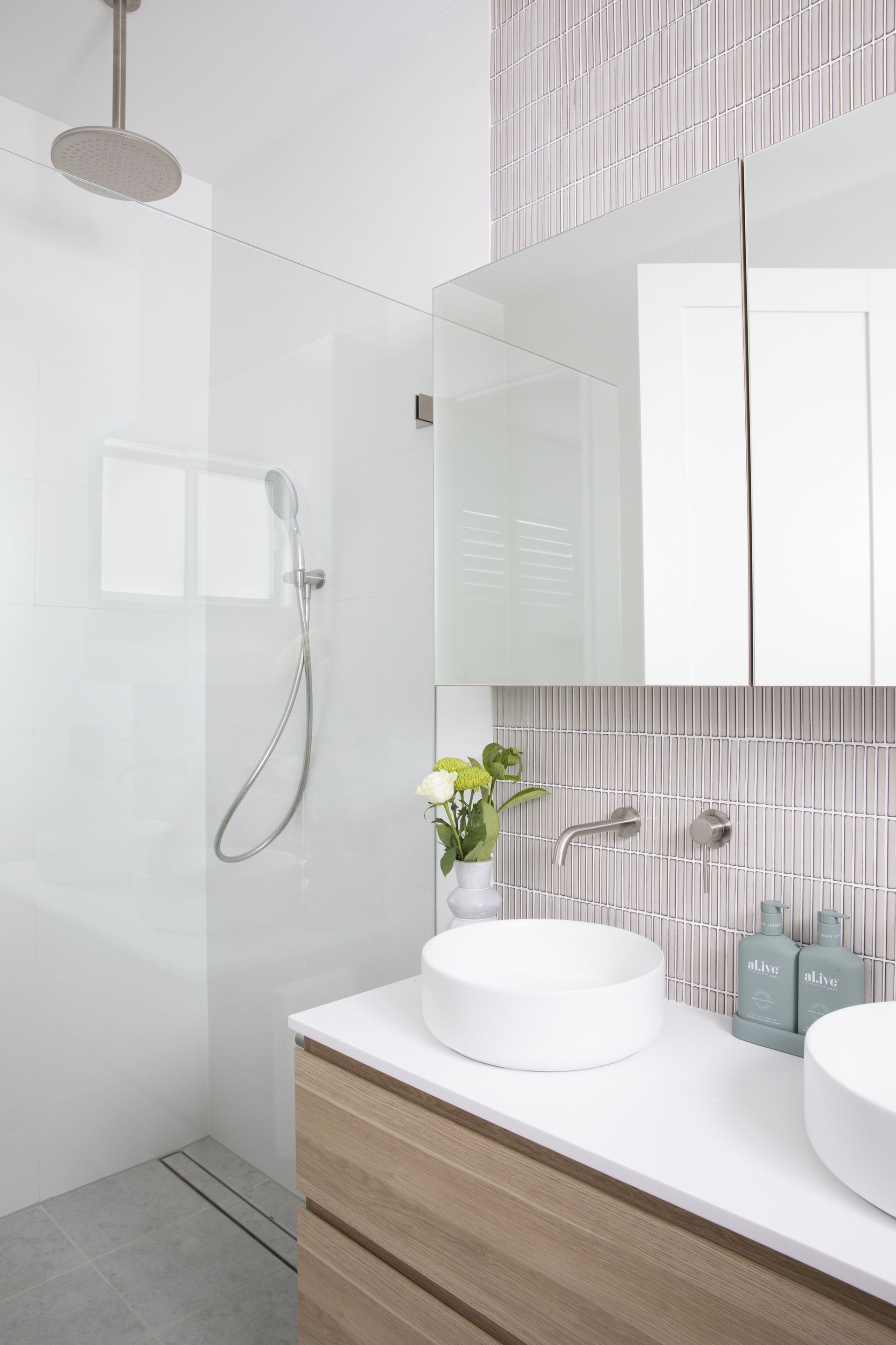 Modern bathroom with two mirrors and two white sinks, showcasing elegant interior design — Caroline Jolly Interiors in Bulli, NSW