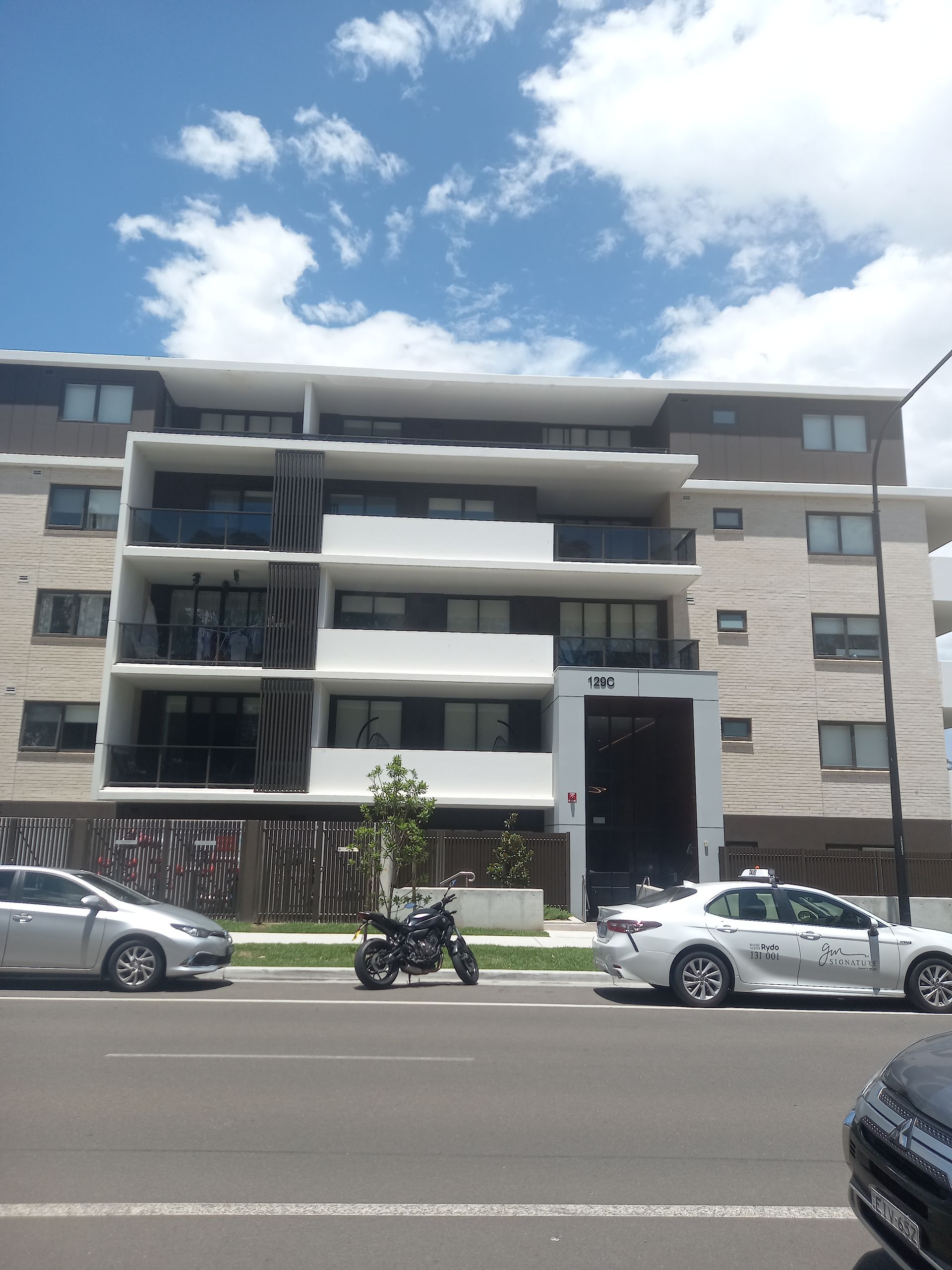 A building with cars parked in front of it