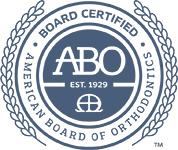American Board of Orthodontics logo with blue laurel wreath and ABO seal, Est. 1929