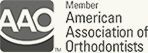 American Association of Orthodontists logo in black and gray text with AAO emblem