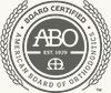 ABO Board Certified seal with circular black text and open book icon in the center