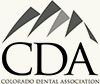 Colorado Dental Association logo with stylized gray mountains and black CDA letters