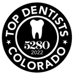 Black-and-white “Top Dentists Colorado” award badge with a tooth icon and “5280” in the center.