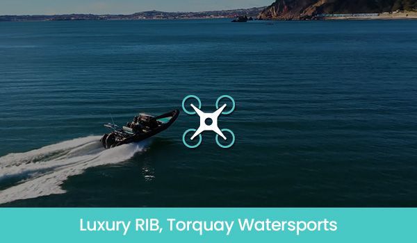 A black RIB boat speeding across blue water; drone icon overlaid.