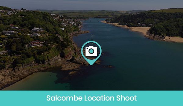 Aerial view of Salcombe estuary with a location marker overlay.