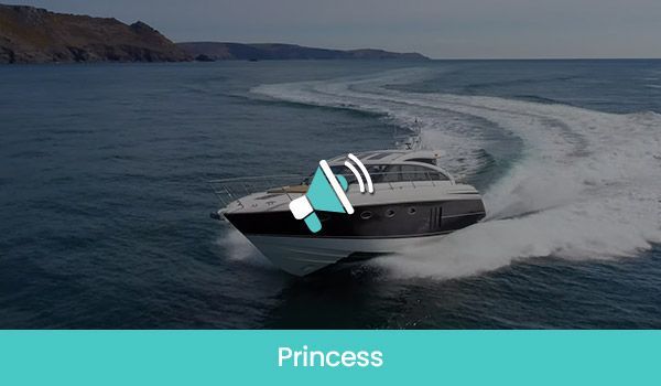 A motor yacht speeds across the ocean, leaving a white wake. The word