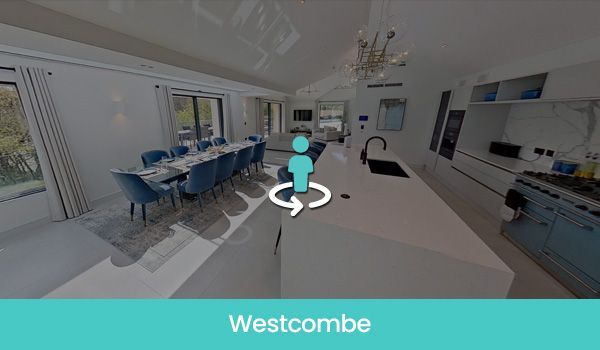 360-degree view of a modern kitchen and dining area with blue accents, including chairs and a stove.